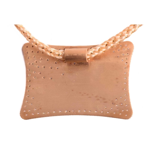 9 - An Indian spinning wheel pendant set with ruby and diamond, featuring an articulated spinning wheel ... 