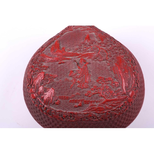 110 - A Cinnabar lacquer peach shape box, the lid depicting an immortal riding through a landscape, with g... 