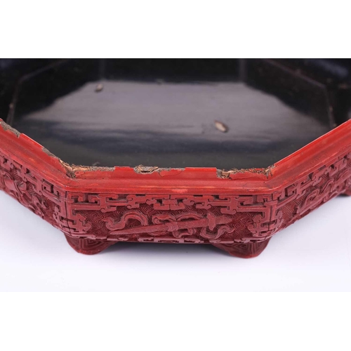 110 - A Cinnabar lacquer peach shape box, the lid depicting an immortal riding through a landscape, with g... 