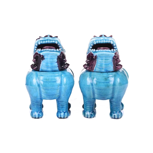 112 - A pair of Chinese standing lion dogs, with removable heads and open mouths, in turquoise and aubergi... 