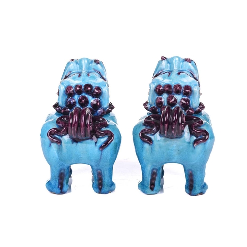 112 - A pair of Chinese standing lion dogs, with removable heads and open mouths, in turquoise and aubergi... 