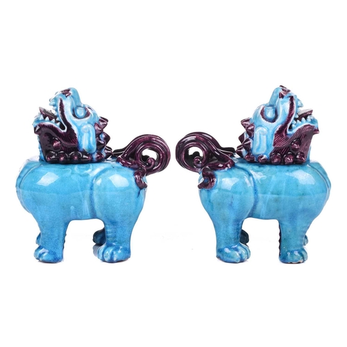 112 - A pair of Chinese standing lion dogs, with removable heads and open mouths, in turquoise and aubergi... 