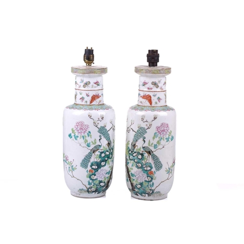 114 - A pair of Chinese Famile Rose porcelain rouleau vases, now as table lamps, late Qing Dynasty, painte... 