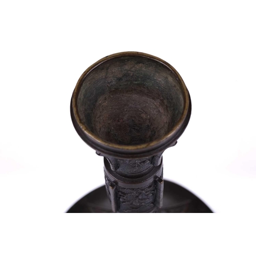 117 - A Chinese bronze Gu-shaped archaic-style vase, late Qing Dynasty, 13 cm diameter x 21.5 cm high