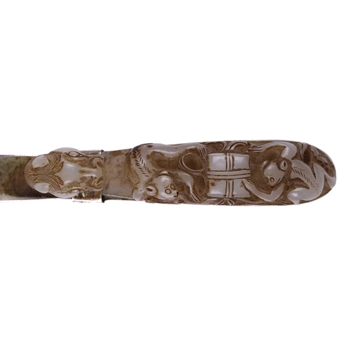 121 - A Chinese carved pale green jade belt hook, carved and pierced with sinuous Chilong and the hook ter... 