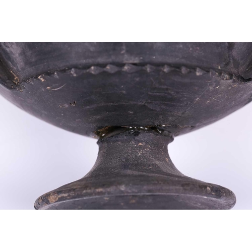 125 - A group of four Etruscan Bucchero-style black pottery vessels, including a large terracotta goblet, ... 