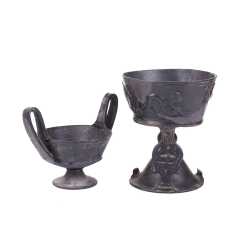 125 - A group of four Etruscan Bucchero-style black pottery vessels, including a large terracotta goblet, ... 