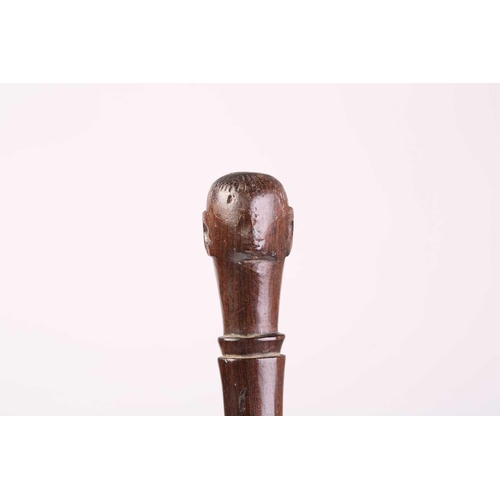 127 - A collection of five African carved wood tribal staffs including two possibly Ovimbundu examples wit... 