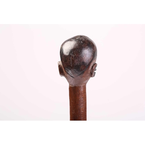 127 - A collection of five African carved wood tribal staffs including two possibly Ovimbundu examples wit... 