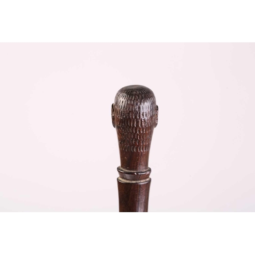 127 - A collection of five African carved wood tribal staffs including two possibly Ovimbundu examples wit... 