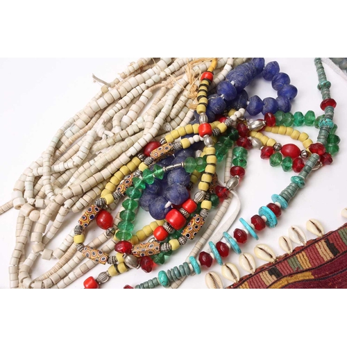 132 - A large collection of principally West African jewellery, to include Ghanaian glass bead necklaces, ... 