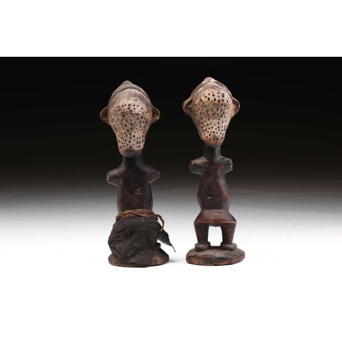 133 - An unusual pair of Janiform female power figures, possibly Songye, Democratic Republic of Congo, bis... 