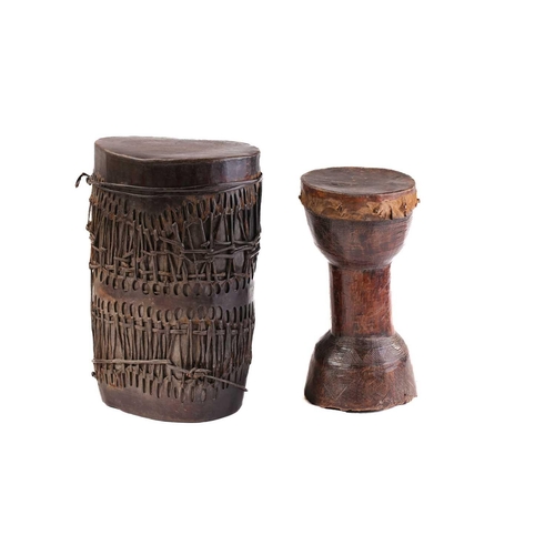 134 - A West African double-ended drum, the cylindrical body bound in animal hide and sinew, diameter: 38c... 