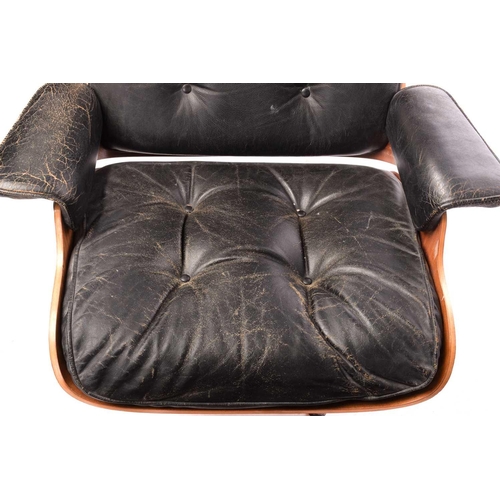 139 - After a design by Charles & Ray Eames, a lounge chair and ottoman (No. 670 and 671), with mahogany f... 