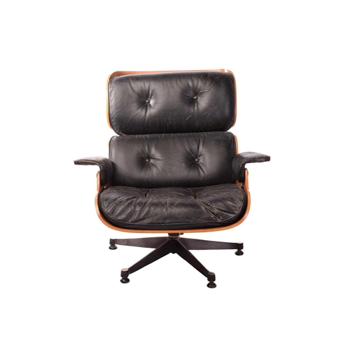 139 - After a design by Charles & Ray Eames, a lounge chair and ottoman (No. 670 and 671), with mahogany f... 