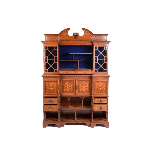 146 - A fine Edwardian mahogany and inlaid inverted breakfront side cabinet, the arched broken pediment ov... 