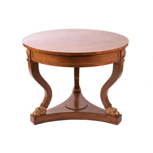 152 - A French Empire Style centre table, the circular top over a gilt beaded panelled frieze and flaming ... 