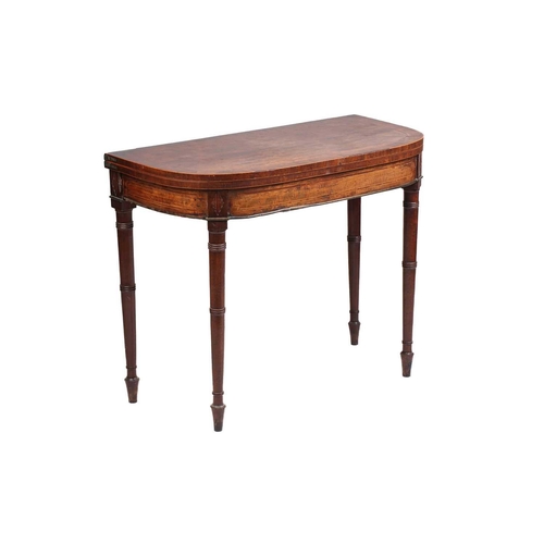 153 - An early 19th century mahogany and rosewood crossbanded foldover card table, with bowed front boxwoo... 