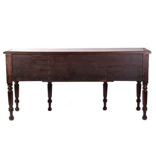 156 - A William IV mahogany breakfront sideboard, the top with plate rest to the back over a bowed centre ... 