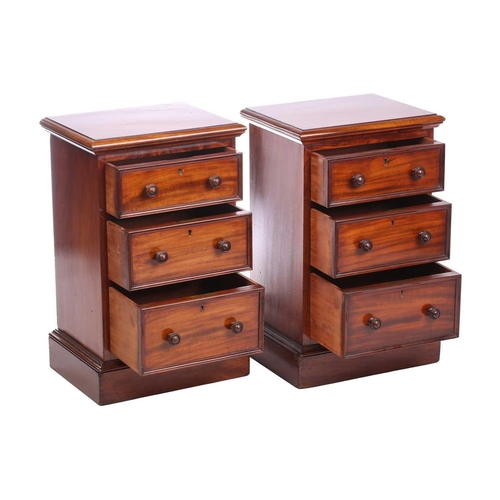 157 - A pair of Victorian mahogany bedside drawers, each with moulded edge top above three graduated drawe... 