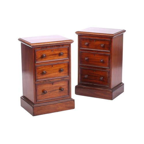 157 - A pair of Victorian mahogany bedside drawers, each with moulded edge top above three graduated drawe... 