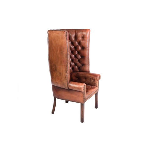 165 - A George III style mahogany and brown hide porters armchair, 20th century, with deep buttoned uphols... 