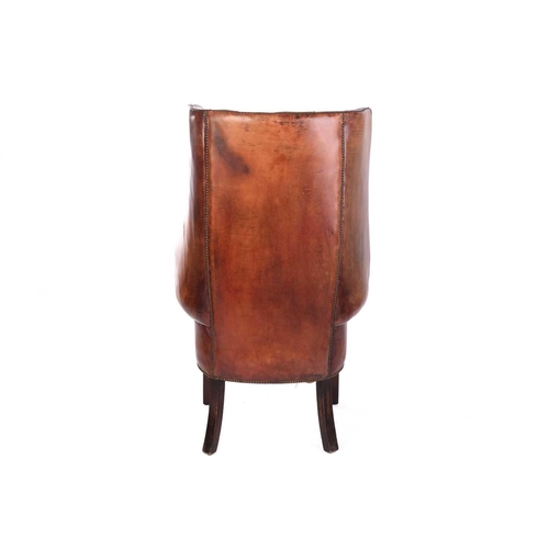 165 - A George III style mahogany and brown hide porters armchair, 20th century, with deep buttoned uphols... 