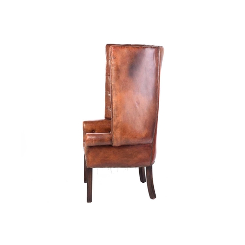 165 - A George III style mahogany and brown hide porters armchair, 20th century, with deep buttoned uphols... 