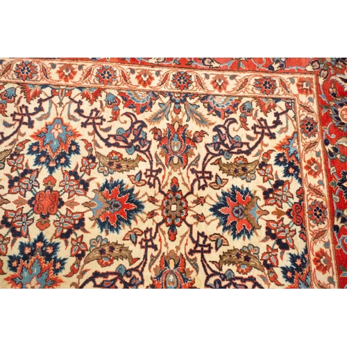 175 - An ivory-ground Najafabad carpet with overall Islimi decoration within brick red palmetted borders. ... 