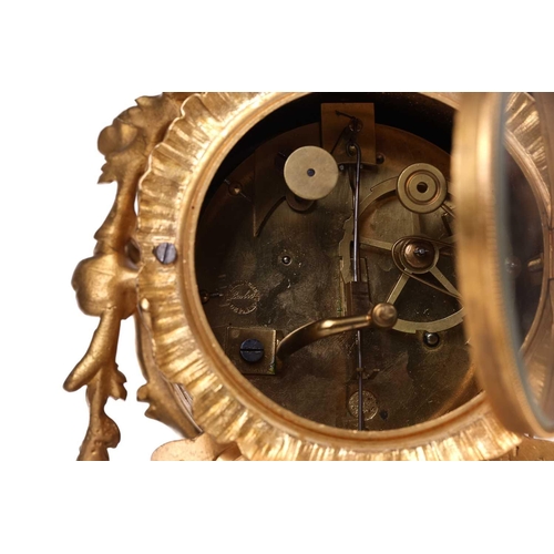 181 - A late 19th century French ormolu clock, with floral garlands and scrolls, the gilt metal dial with ... 