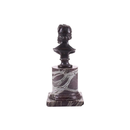 183 - A bronze bust of Lord Frederick Leighton (1830-1896), on an associated red marble cylindrical column... 