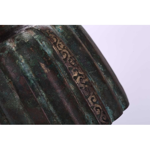 185 - An bronze incense burner, in the Ottoman style, probably 20th century, the ribbed body below a taper... 