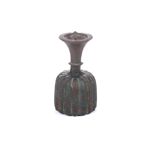 185 - An bronze incense burner, in the Ottoman style, probably 20th century, the ribbed body below a taper... 