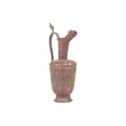 186 - A 'Khorosan' style ewer, probaly North east Iran, of fluted lobed form, with stylised Islamic inscri... 