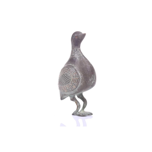 190 - A Khorasan style bronze bird, Persia, possibly 11th/12th century, the bulbous body, with scaled carv... 