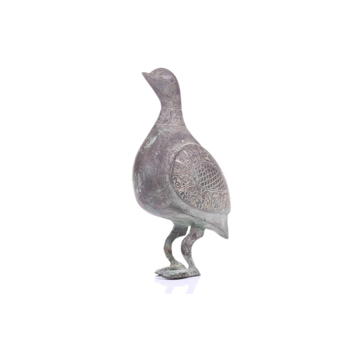 190 - A Khorasan style bronze bird, Persia, possibly 11th/12th century, the bulbous body, with scaled carv... 