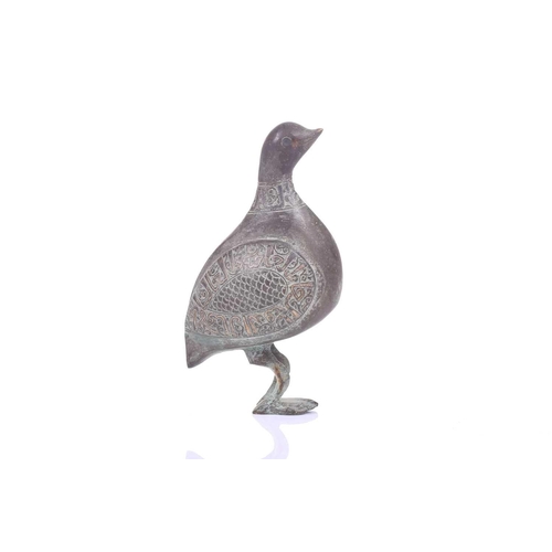 190 - A Khorasan style bronze bird, Persia, possibly 11th/12th century, the bulbous body, with scaled carv... 