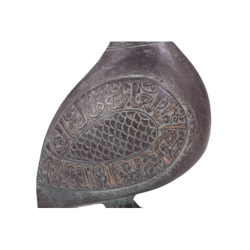 190 - A Khorasan style bronze bird, Persia, possibly 11th/12th century, the bulbous body, with scaled carv... 