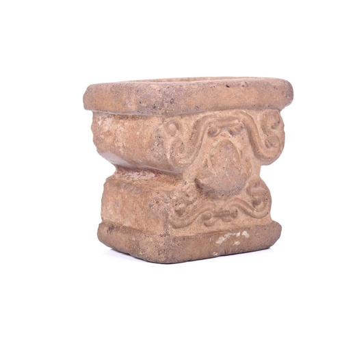 191 - An Abbasid-style carved terracotta capitol with scroll decoration. 13 cm wide x 10 cm deep x 13 cm h... 