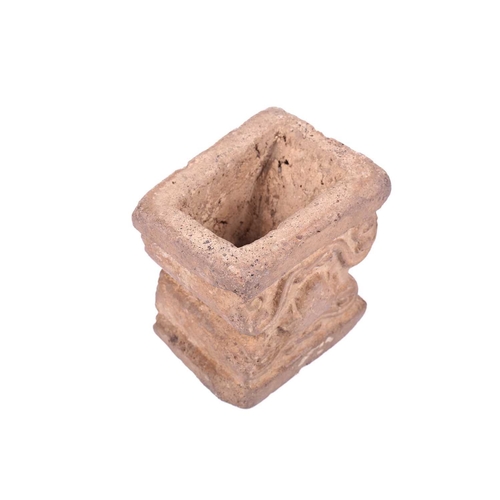 191 - An Abbasid-style carved terracotta capitol with scroll decoration. 13 cm wide x 10 cm deep x 13 cm h... 