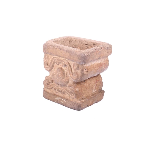 191 - An Abbasid-style carved terracotta capitol with scroll decoration. 13 cm wide x 10 cm deep x 13 cm h... 