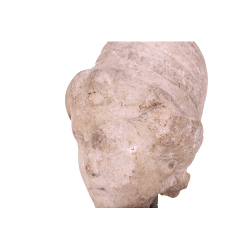 197 - A Marble head of a female, Roman 2nd cenutry and later, depicted in traditional form, with later car... 