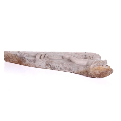 201 - A Roman Marble fragment, 2nd/3rd century AD, possibly part of a sarcophagus, depicitng a youth in ro... 