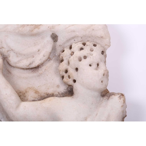 201 - A Roman Marble fragment, 2nd/3rd century AD, possibly part of a sarcophagus, depicitng a youth in ro... 