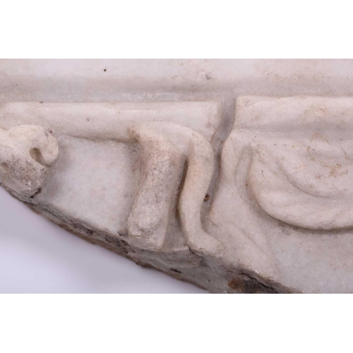 201 - A Roman Marble fragment, 2nd/3rd century AD, possibly part of a sarcophagus, depicitng a youth in ro... 