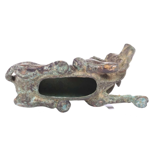 202 - A Chinese bronze and gilt recumbent bull, possibly Zhou dynasty or later, the animal with one leg ou... 