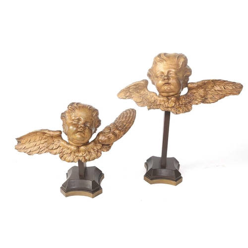 209 - A collection of decorative items, including two carved and painted wood winged cherub mounts, on lat... 