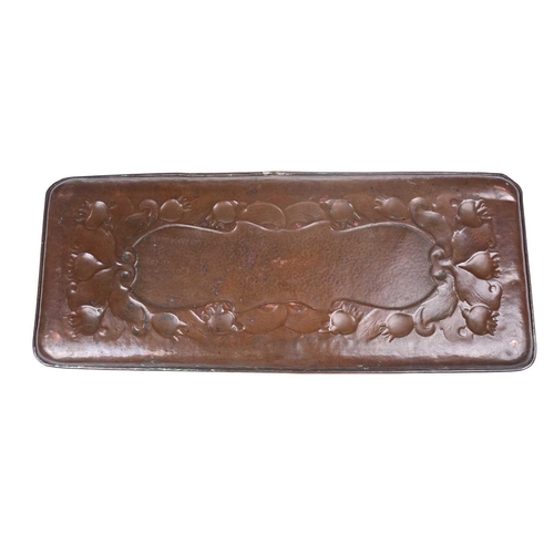 211 - A Newlyn School rectangular dressing table copper tray embossed with floral buds and a central carto... 