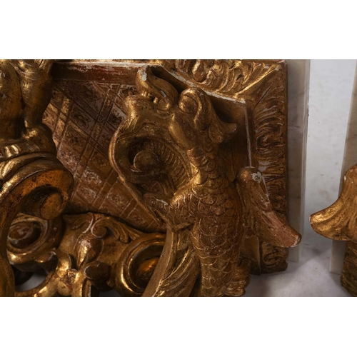 213 - A pair of carved wood and gilt gesso wall brackets with shaped marble tops, late 19th century/ early... 