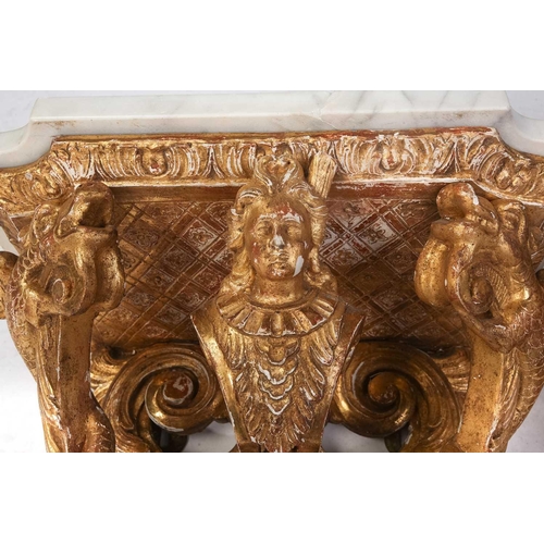 213 - A pair of carved wood and gilt gesso wall brackets with shaped marble tops, late 19th century/ early... 